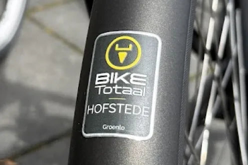Bike Totaal Hofstede metal label on a bicycle frame