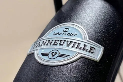 Vanneuville bike center metal label on a mudguard